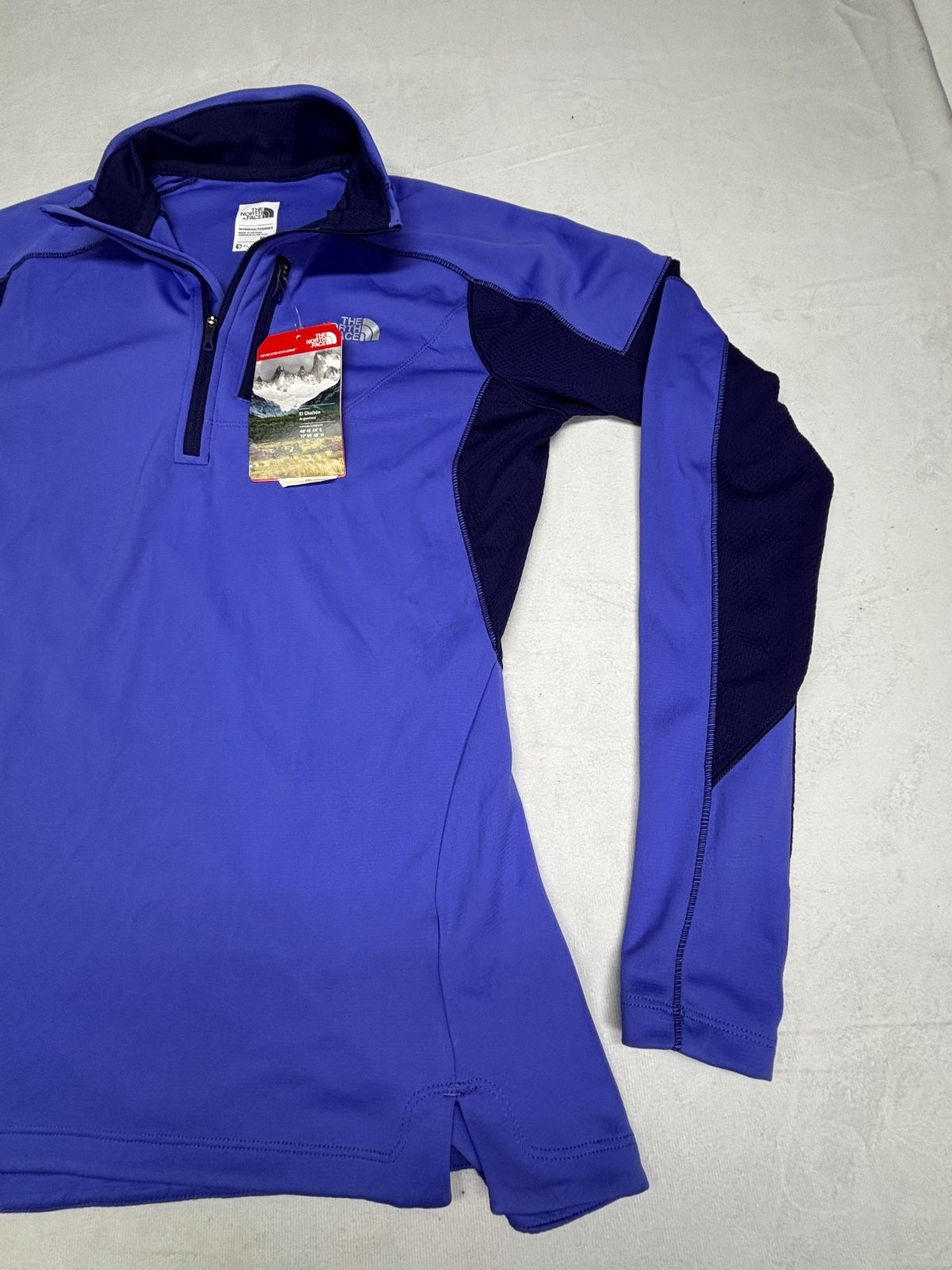 The North Face women's purple running 1/4-zip long sleeve top Performance